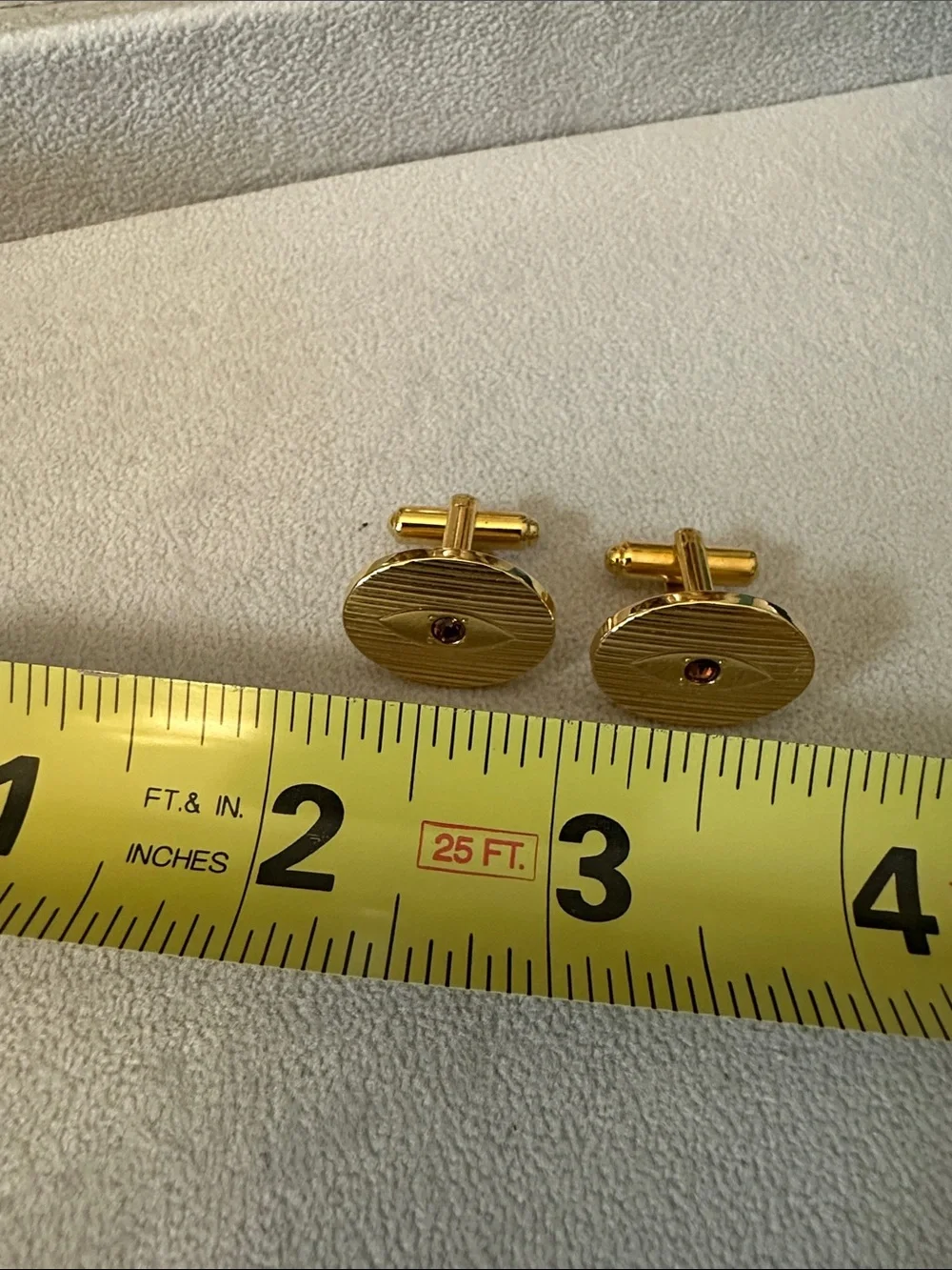 Gold Oval Cufflinks with Garnet Center
